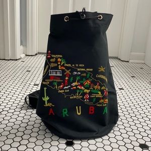 Aruba embroidered drawstring sling bag